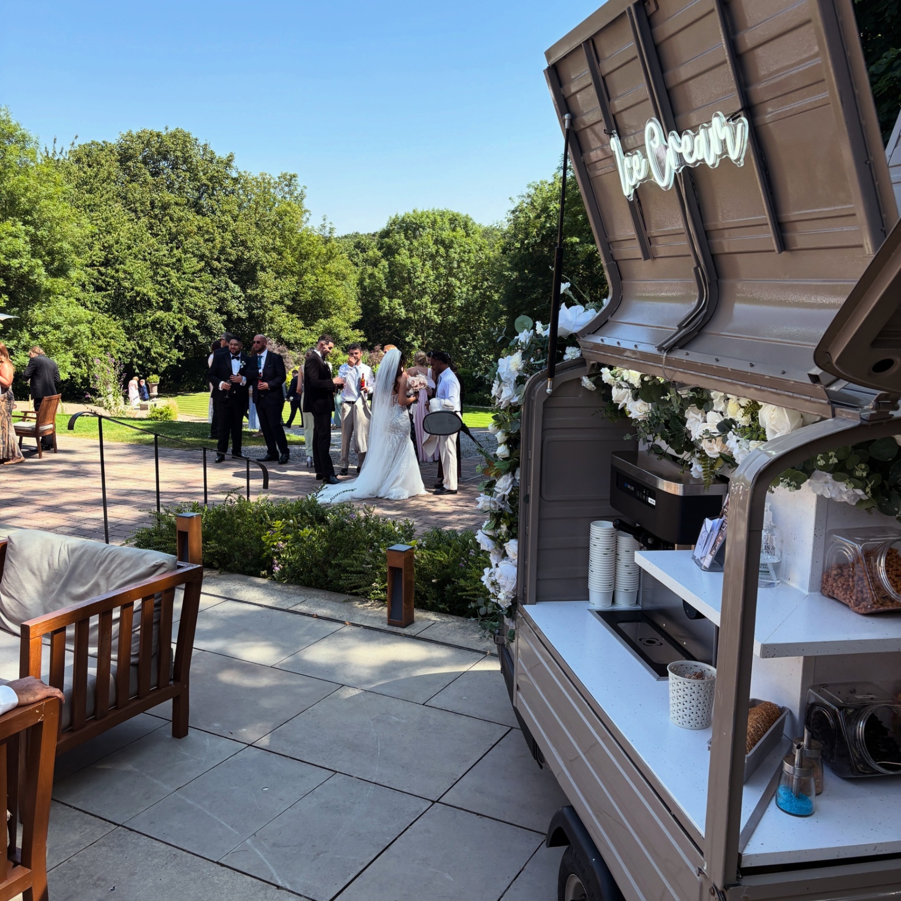 Wide outdoor view of the Ice Cream Tuk at a wedding venue