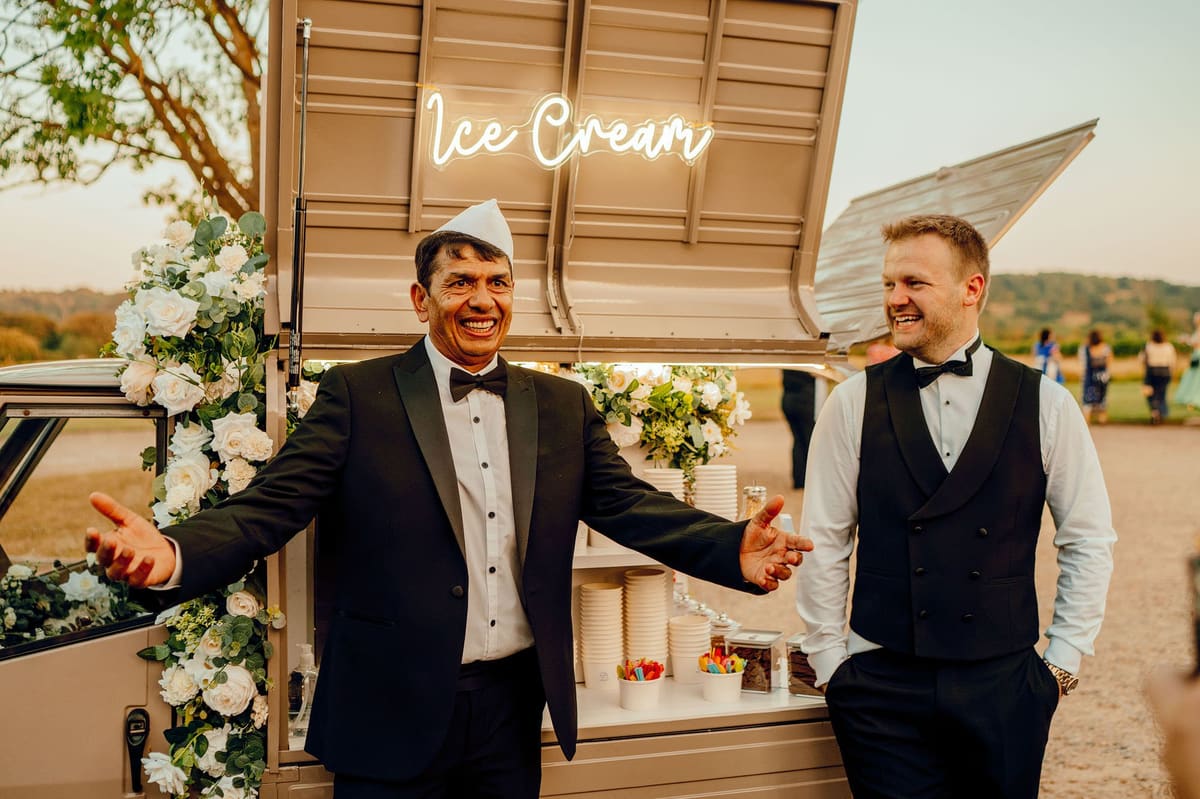 Couple enjoying soft-serve from the Ice Cream Tuk at their Wharfedale Grange wedding